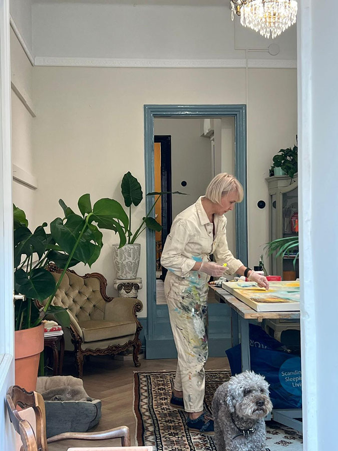 Reily finishing the painting